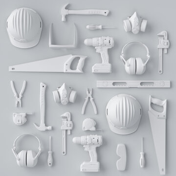 Top view of monochrome construction tools for repair and installation on white
