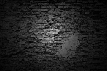 Soft light on dark brick wall texture background