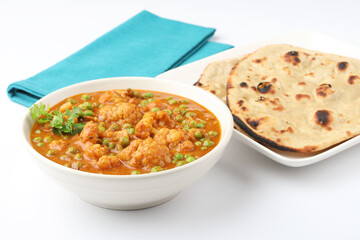 Mix vegetable curry with Naan or Indian bread and raita, Indian meal