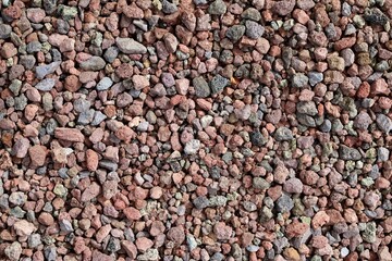 Multicolor decorative pebbles used in the garden,flower beds or yard.  Background and texture