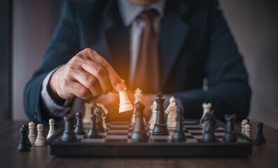 Businessman play chess board game. A white chess team and black chess team  idea for business competition and team work.
