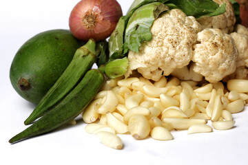 Isolated Group of Mix Vegetable, Onions, Cauliflower, Peeled Garlic on White Background.