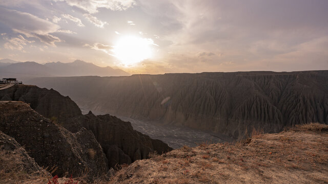 Dushanzi Grand Canyon in Karamay, Xinjiang, with the sun shining brightly over the Kuitun River