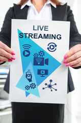 Live streaming concept shown by a businesswoman
