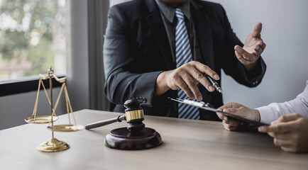 Attorneys advising in cases where a client has been defrauded by a defendant who is a business partner forming a joint company, advising on litigation and gathering evidence. Fraud case concept.
