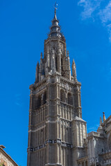 Fototapeta na wymiar Detailed tower view at the gothic monument building Primate Cathedral of Saint Mary of Toledo