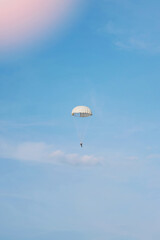 Man on white parachute