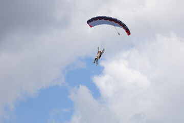 Skydiving. A skydiver is landing.