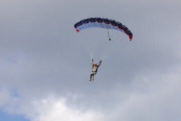 Skydiving. A skydiver is landing.