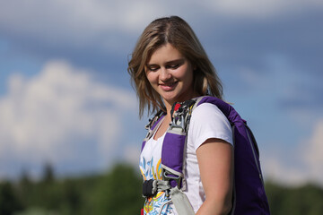 Skydiving. A pretty girl is a skydiver.