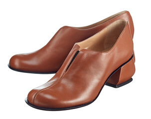 Elegant closed summer women's shoes made of brown leather with a heel, isolated on a white background. Summer women's shoes. Top view at an angle.