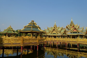 Fototapeta na wymiar Pergolas on the water, connected by bridges, in the ancient Thai style. 