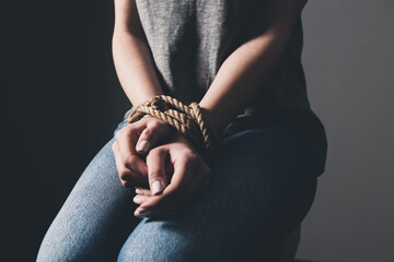young woman's hands are tied