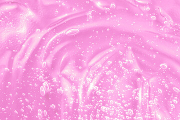 Obraz premium Hyaluronic acid with retinol and ceramide swatch. Pink toner smear smudge texture. Gel serum liquid cosmetics, cream with collagen sample. Jelly cleanser cosmetic product. Close-up, macro.