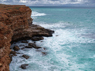 view of ocean waves and a fantastic rocky shore
