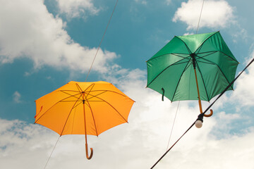 Colorful umbrellas in the sky. Multicolored umbrellas in the sky, creating a summer, art mood on the street