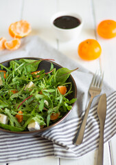 Fresh salad with tengerines and cheese