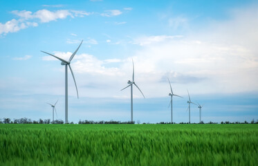 Wind turbines generating electricity with blue sky - energy conservation concept