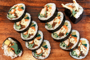 Korean kimpab rolls with vegetables and chicken top view.