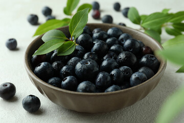 Fresh berry concept with blueberry on white textured table