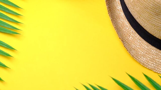 template for text, flying background summer holiday concept, hat coconut and palm leaves on yellow background