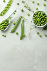 Fresh green pea on white textured background