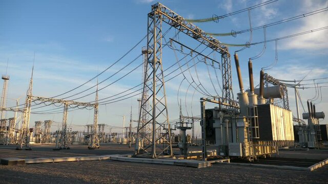 Electric power station with lofty metallic pillars and square transformators