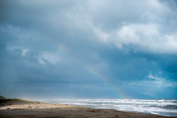 Storm Clouds & Rainbow over the sea, Karamea, West Coast, New Zealand