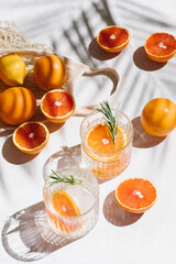 Summer orange cocktails with fresh citrus fruits. Hard seltzer, lemonade, refreshing drinks, low...