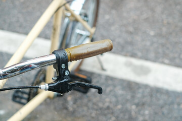Close up bicycle handlebar in vintage color tone, selective focus , rainy day
