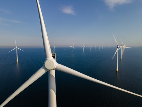 Wind turbine from an aerial view, Drone view at windpark a windmill farm in the lake IJsselmeer the biggest in the Netherlands, Sustainable development, renewable energy. 