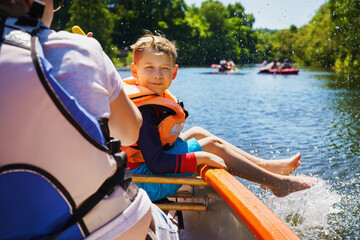a happy child boating in summer