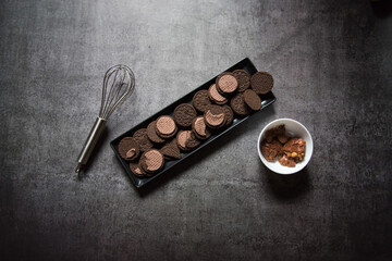 Cookies on a black tray with use of selective focus. Top view.