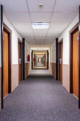 long corridor with carpet floor