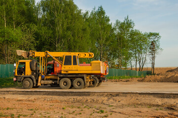 Obraz premium Heavy equipment parked near conctruction site. Industrial sand quarry.