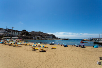 Fototapeta na wymiar The village of Puerto Rico and the beach on Gran Canaria