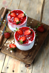 Chia yogurt with strawberry topping. Healthy summer dessert with strawberries. Keto dessert.