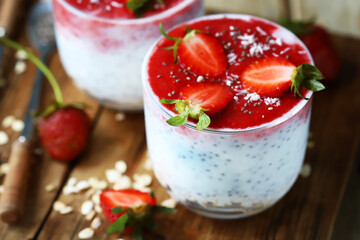 Chia yogurt with strawberry topping. Healthy summer dessert with strawberries. Keto dessert.