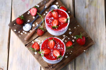 Chia yogurt with strawberry topping. Healthy summer dessert with strawberries. Keto dessert.