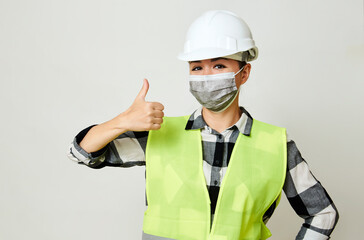 Waist up portrait of female builder with hardhat on white background