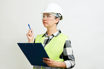 Portrait of female construction worker on white background