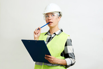 Portrait of female construction worker on white background