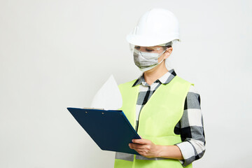 Engineer woman worker with hard hat and paper clipboard