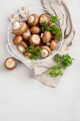 Champinion mushrooms on light background. Vegan food concept.