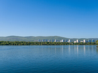 Obraz premium The Yenisei River. View of the city of Krasnoyarsk. Summer sunny day. Clear sky