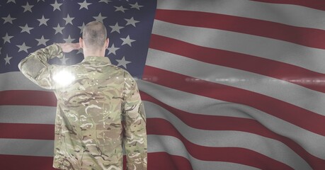 Composition of soldier saluting against american flag