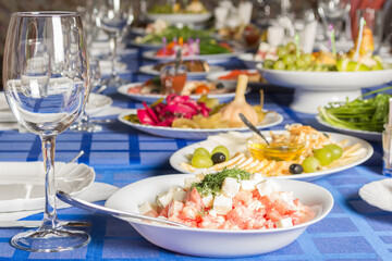 Dinner table with food and drinks set in honor of the feast.