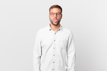 handsome blonde man feeling disgusted and irritated and tongue out