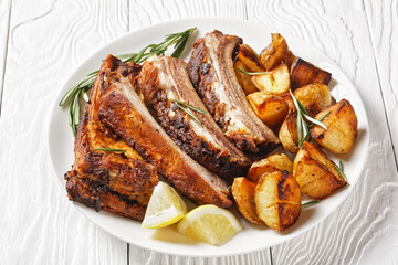grilled pork ribs served with roast new potatoes