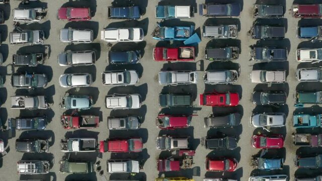 Aerial drone view over cars in an auto wreckers yard.